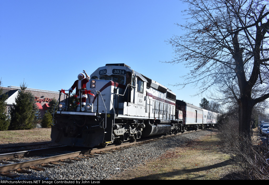 Susie Q Arriving into Downtown Wyckoff with Santa Claus waving along the front platform of SD40-2 # 3024